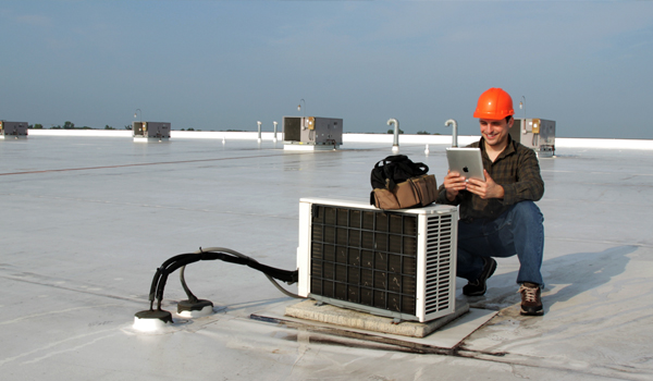 HVAC tech using a mobile app